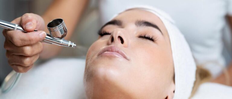 Close-up of a client enjoying an Oxygen Facial Vienna, VA treatment with an airbrush oxygen device for glowing, hydrated skin.